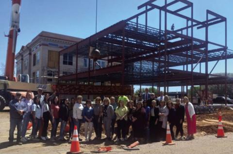 Jackson County employees, members of the District III justice team, and contractors Joe D. Hall, Inc., pictured with the signed beam before it was put in place Kevin Hilley | Altus Times