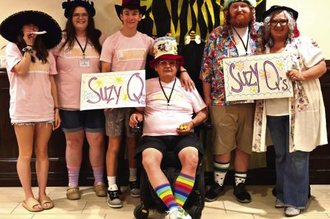 THE SUZY Q’s, wearing Grandma Suzy’s hat collection, with team spellers Emilee Johnson, Chandler Crow, and Bill Hanson, and their cheering section won the prize for the Best Cheering Section at the Grate Spelling Bee on April 6.