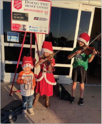 Siblings share musical talents during Red Kettle event