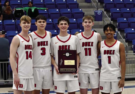 Senior members of the Duke Tigers basketball team display the first-place trophy they won in their regional tournament. Pictured from left are Lane Womack, Mason Linares, Caleb Ames, Morgan Reynolds, and Jordan Chevis. Courtesy photo