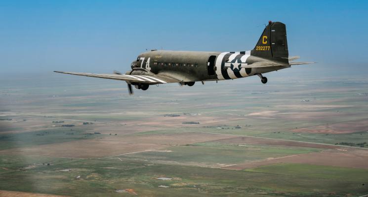 The WWII Airborne Demonstration Team recently hosted Summer Jump School 2023. Pictured is the Team’s WWII era C-47, Boogie Baby. The team utilizes “chase” planes for media and photography purposes and this photo was shot through the window of their chase plane, the T-6 Texan, built in 1949. Kathleen Guill | Press-Leader