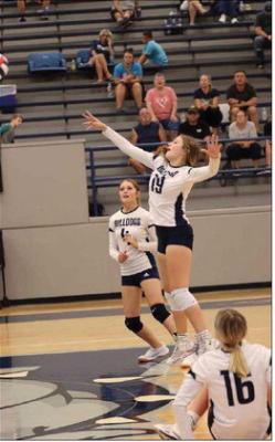 Makenzie Pokorny jumps to make a shot at a recent Volleyball game against Elgin. Courtesy photo | Thu Scott